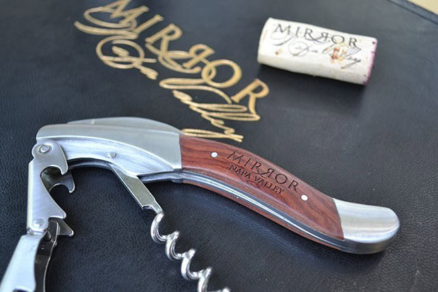 Elegant mirror-themed corkscrew with wooden handle and matching box for wine accessories.